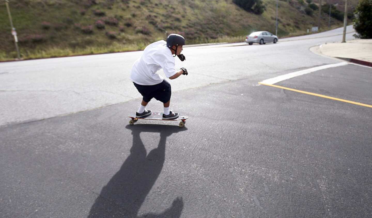 Los Angeles' skateboarding rule would require skaters, like this one on Dodson Avenue in San Pedro, to follow a 25-mph speed limit and obey all traffic rules.