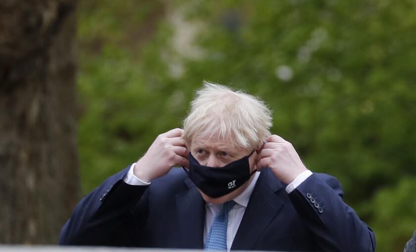 Britain's Prime Minister Boris Johnson arrives at the G7 foreign ministers' meeting in London, Wednesday, May 5, 2021. Foreign ministers from the Group of Seven wealthy industrialized nations gather in London to grapple with threats to health, prosperity and democracy. It is their first face-to-face meeting in more than two years. (AP Photo/Frank Augstein, pool)