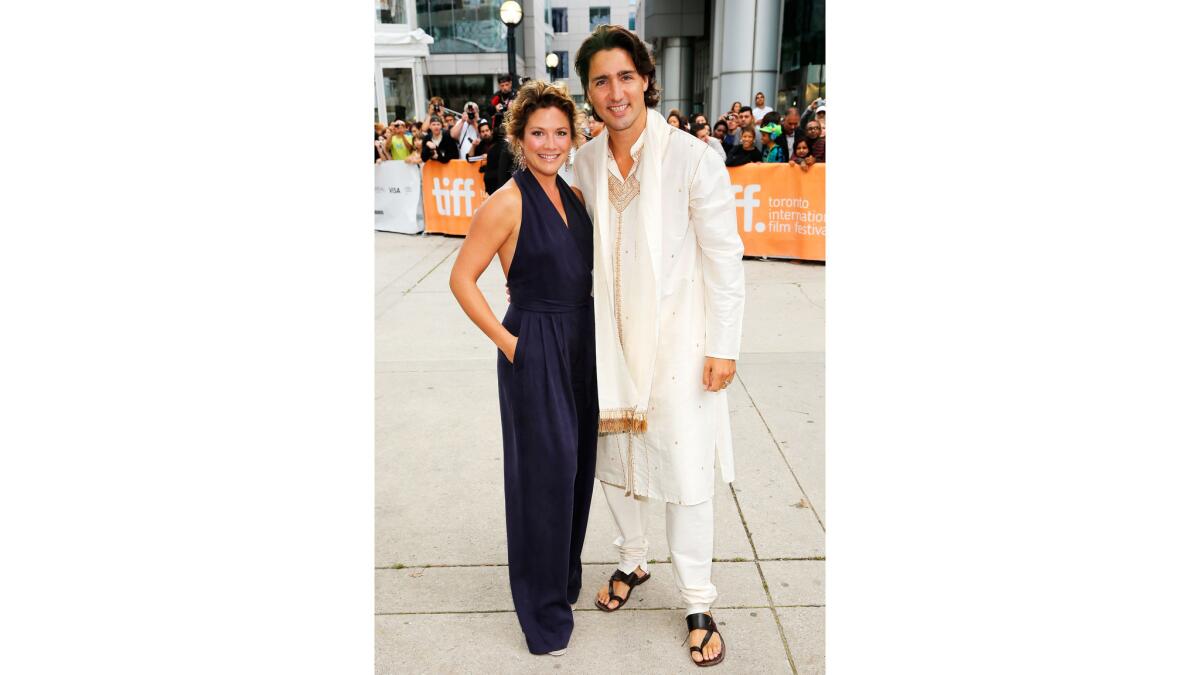 Justin Trudeau, in a flowing white ensemble paired with strappy black mandals, and wife Sophie Gregoire, in a navy blue jumpsuit, at the Toronto International Film Festival on Sept. 9, 2012.
