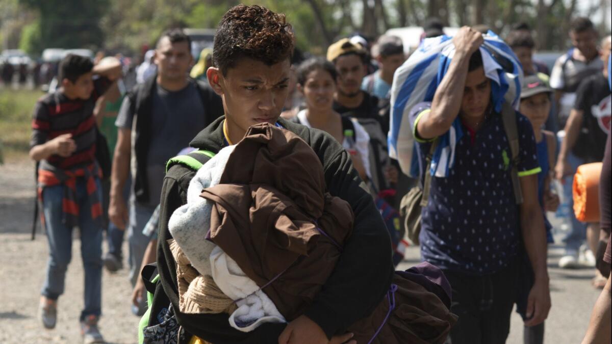 Central American migrants walk on a road in Tapachula, Chiapas State, Mexico on March 28.