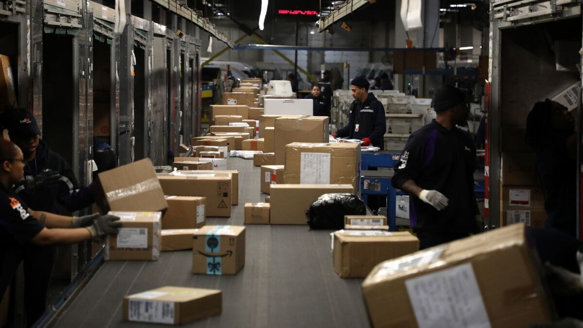 Packages roll through a FedEx Express sorting facility in Chicago this month.