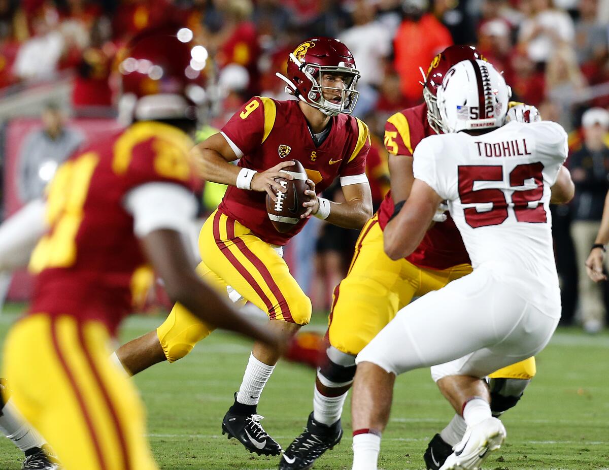 USC quarterback Kedon Slovis looks for an open receiver downfield against Stanford in the first quarter at the Coliseum on Saturday.