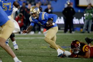  UCLA quarterback Dorian Thompson-Robinson runs against rival USC.