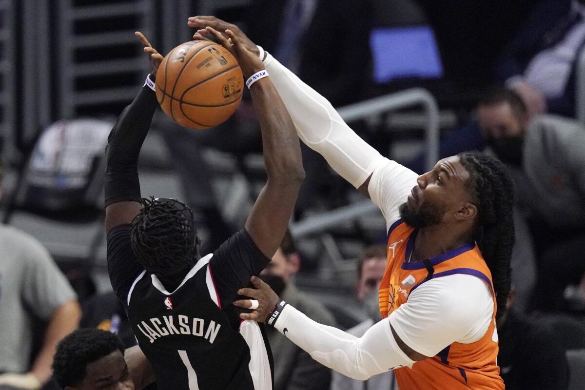 Suns forward Jae Crowder tries to block a shot by Clippers guard Reggie Jackson during Game 3.