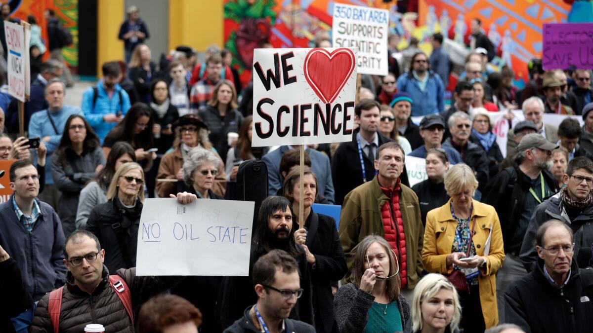 Hundreds of scientists protest during a December meeting of the American Geophysical Union in San Francisco to denounce Donald Trump's position on climate change.