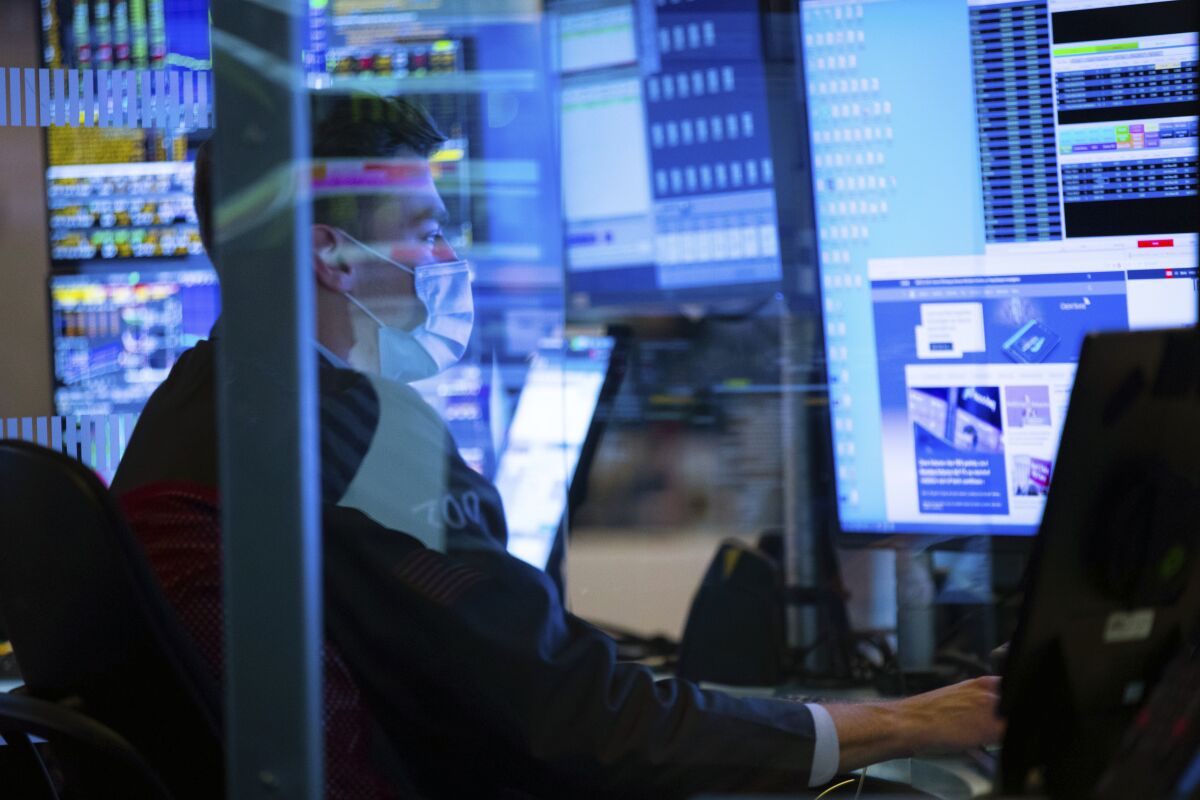 A trader works at the New York Stock Exchange