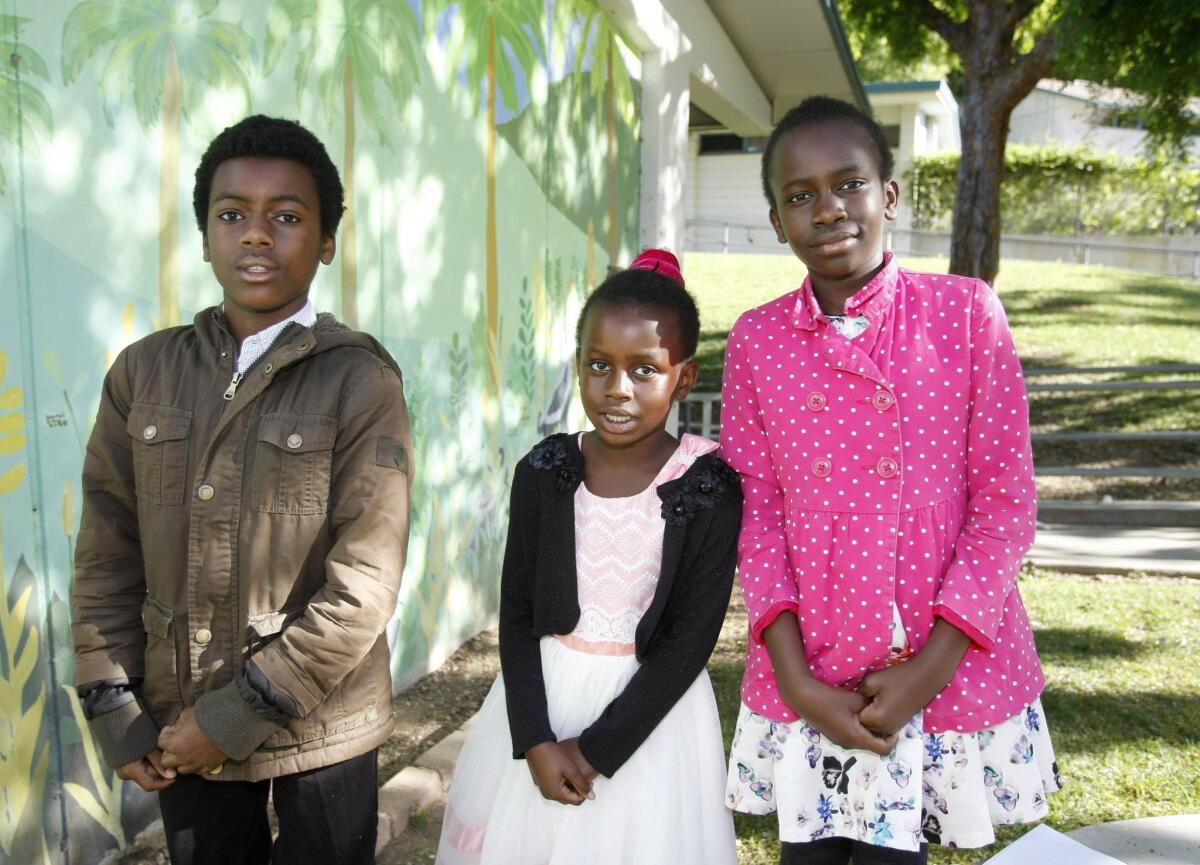 Palm Crest Elementary School sixth-grader Elijah Otieno, left, and his sisters, second-grader Nicole Otieno and fifth-grader Ashley Otieno.