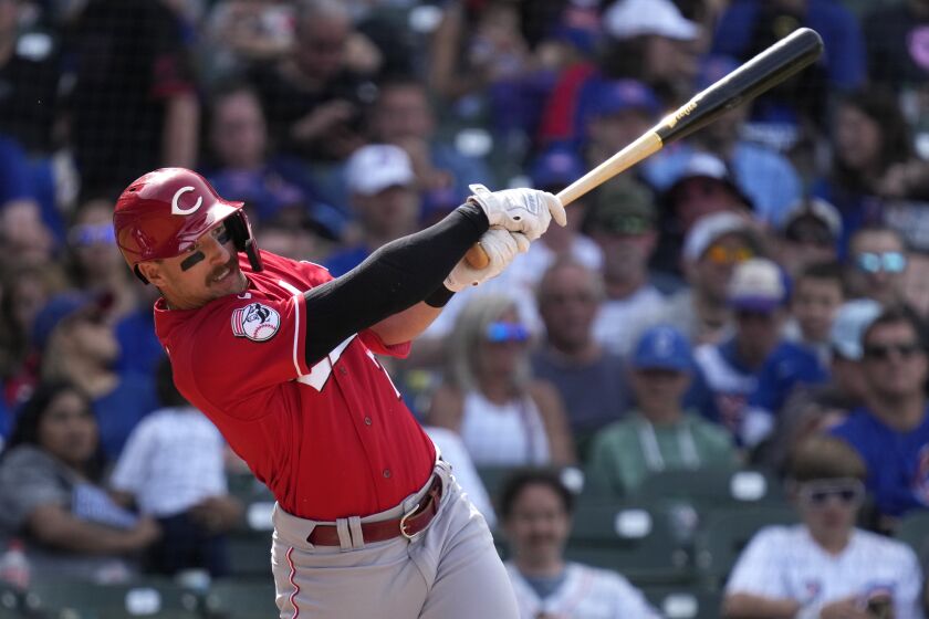 Cincinnati Reds' Spencer Steer hits a single during the eighth inning of a baseball game against the Chicago Cubs in Chicago, Sunday, May 28, 2023. (AP Photo/Nam Y. Huh)