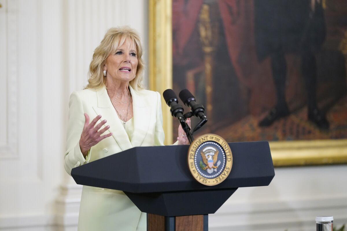 FILE - First lady Jill Biden introduces President Joe Biden to speak at a St. Patrick's Day celebration in the East Room of the White House, March 17, 2022, in Washington. An Associated Press book written by Julie Pace and Darlene Superville is set to be published next week. (AP Photo/Patrick Semansky, File)