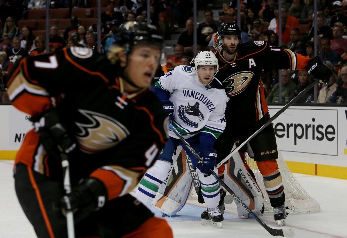 Vancouver Canucks forward Sven Baertschi fights for a position near the goal against Ducks forward Ryan Kesler in the second period of a game Oct. 12.