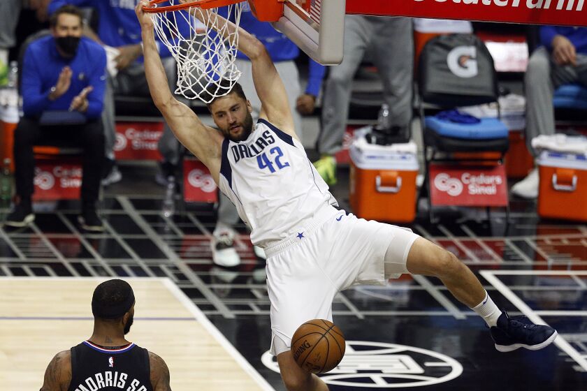 LOS ANGELES, CA - MAY 25: Dallas Mavericks forward Maxi Kleber (42) slam dunks the ball in a game against the LA Clippers in the first period at the Staples Center on Tuesday, May 25, 2021 in Los Angeles, CA. Game two of the NBA Western Conference first-round playoff series. (Gary Coronado / Los Angeles Times)