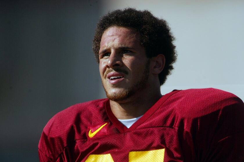 051972.SP.0829.tailbacks.AG -- USC running back Justin Fargas takes a break during practice Thursday on the campus football field.