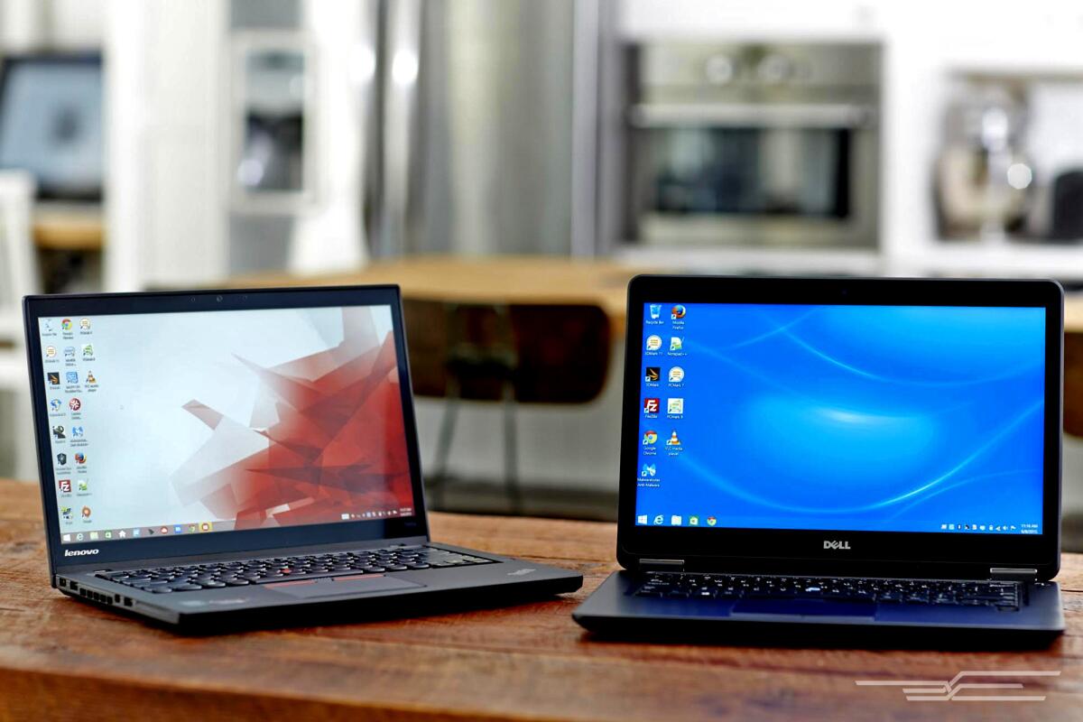 The Lenovo ThinkPad T450s (left) and the Dell Latitude E7450 (right).