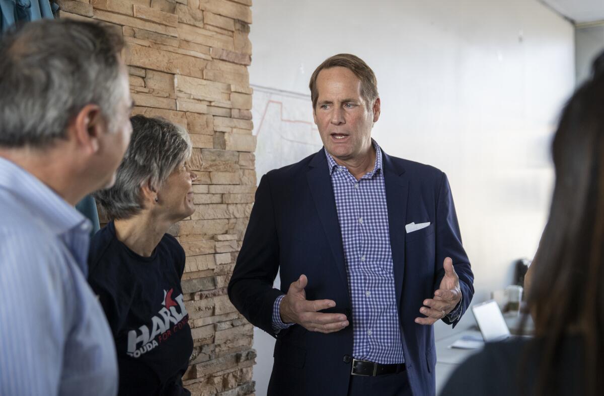 Democrat Harley Rouda speaks to volunteers and supporters during a Retire Rohrabacher Party at Rouda's campaign office in Costa Mesa.
