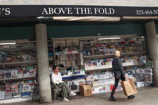 Los Angeles, CA - September 19: A woman walks by the Above the Fold newsstand on Thursday, Sept. 19, 2024 in Los Angeles, CA. (Michael Blackshire / Los Angeles Times)