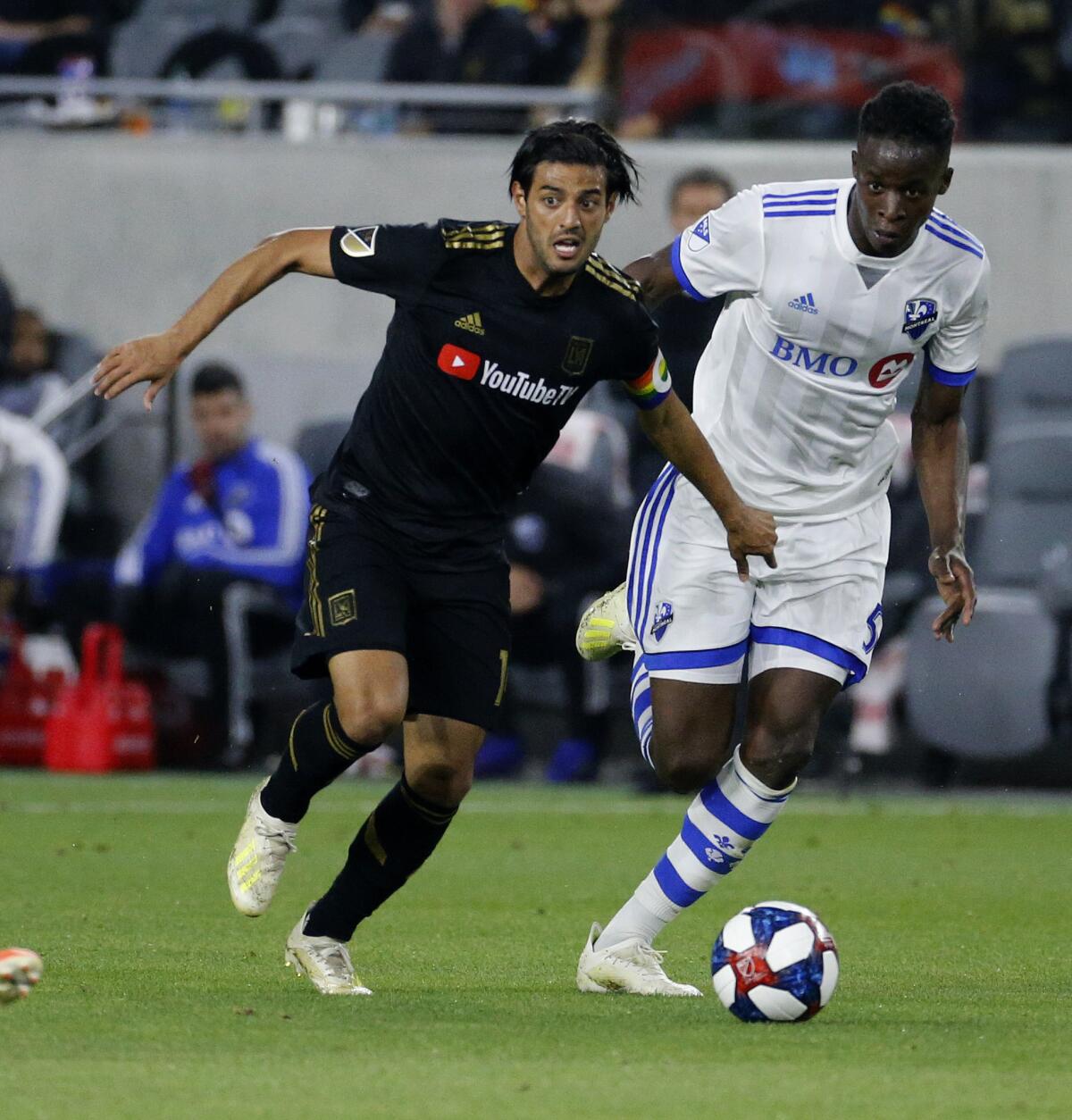 Los Angeles FC forward Carlos Vela (10) of Mexico, vies with Montreal Impact defender Zakaria Diallo (5) of France, in an MLS soccer match between Los Angeles FC and Montreal Impact in Los Angeles, Friday, May 24, 2019. LAFC won 4-2.