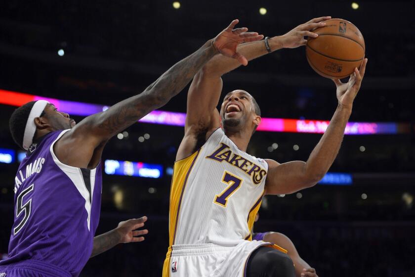 Forward Xavier Henry (7) shoots over Sacramento Kings forward John Salmons during the first half of the Lakers' 100-86 victory in November.