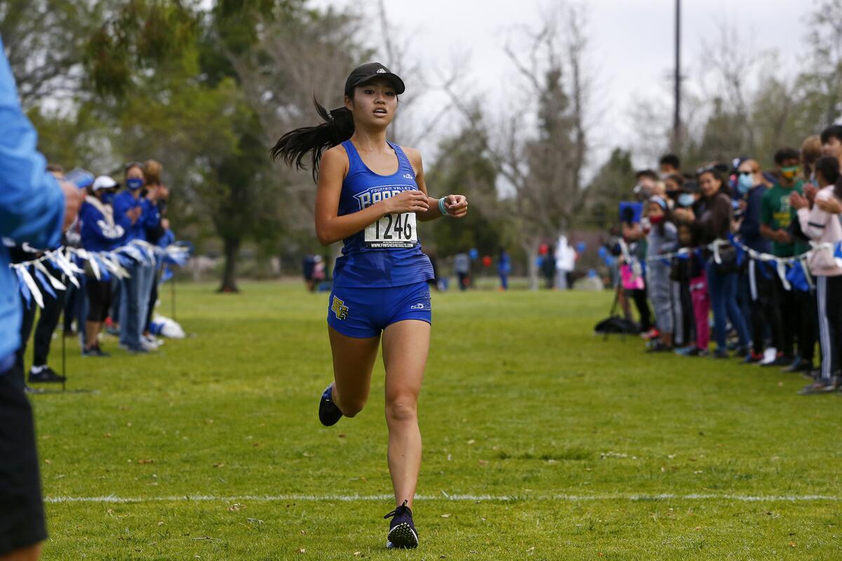 Fountain Valley's Kaho Cichon finishes first for the Surf League girls in the cross-country finals.