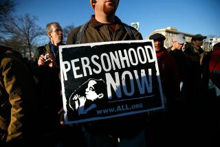 A pro-life activist holds a sign as he participates in the annual "March for Life" event January 22, 2009 in Washington, DC. 