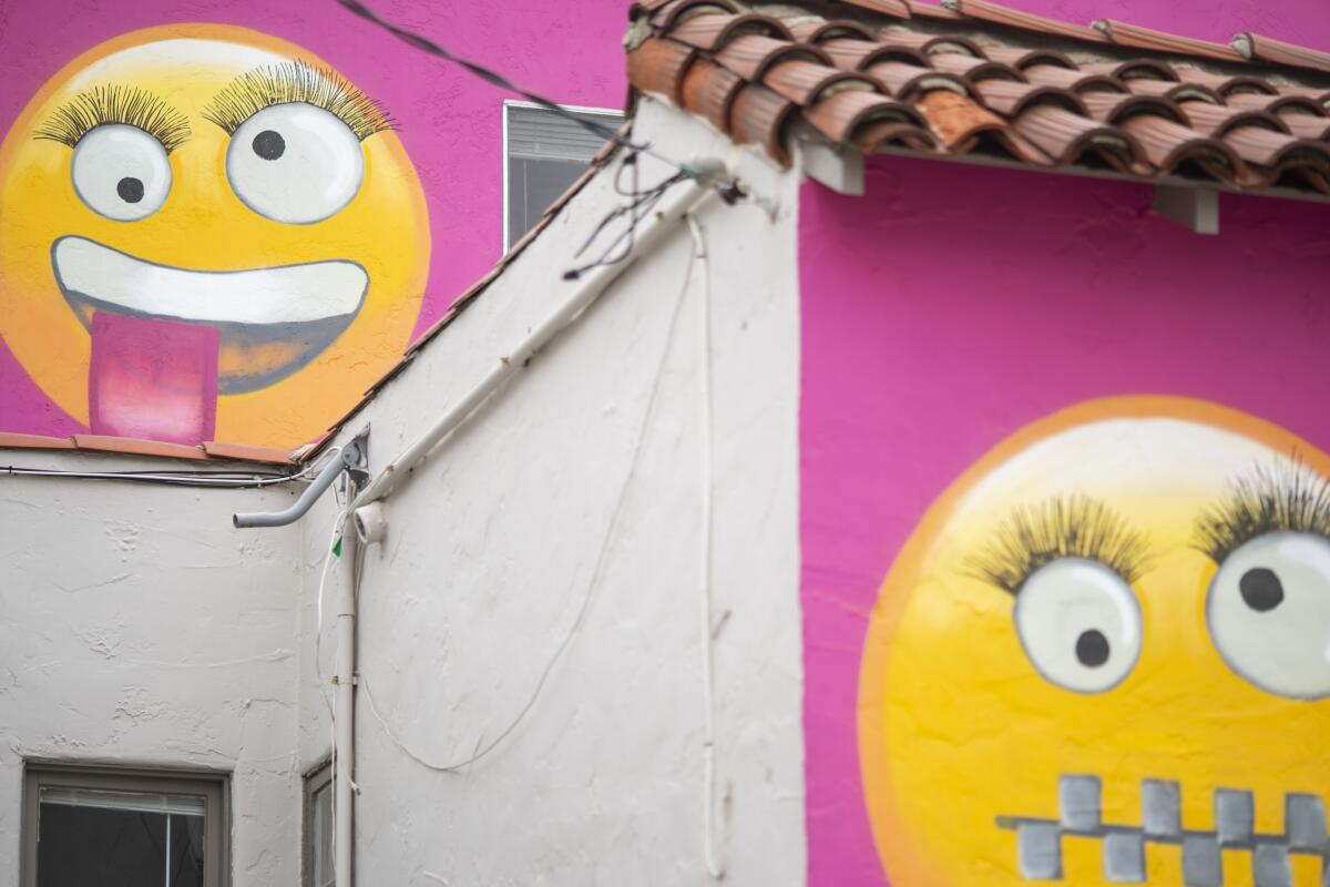 A close-up at the emojis painted on the "Emoji House" in Manhattan Beach.