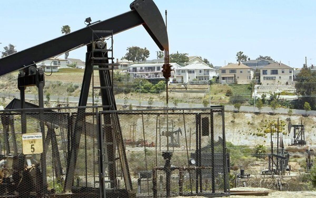 Pump jacks work the Inglewood Oil Field near homes