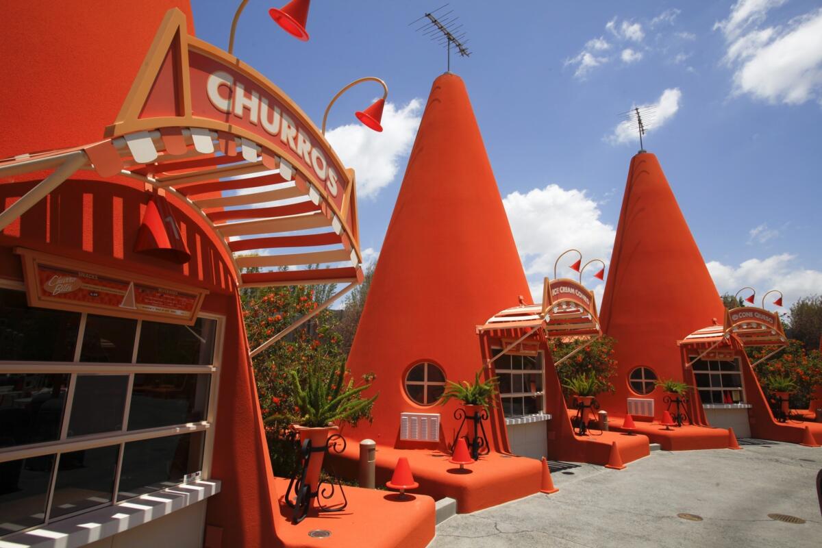 The Cozy Cone Motel at Disneyland serves bread cones full of chili and cheese.