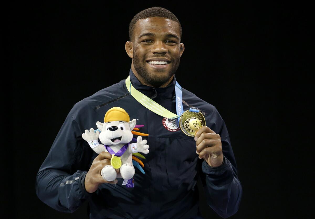 U.S. wrester Jordan Burroughs wears his gold medal earned in the men's freestyle 74 kg competition in July at the Pan Am Games. He is scheduled to compete on Saturday at the world championships.
