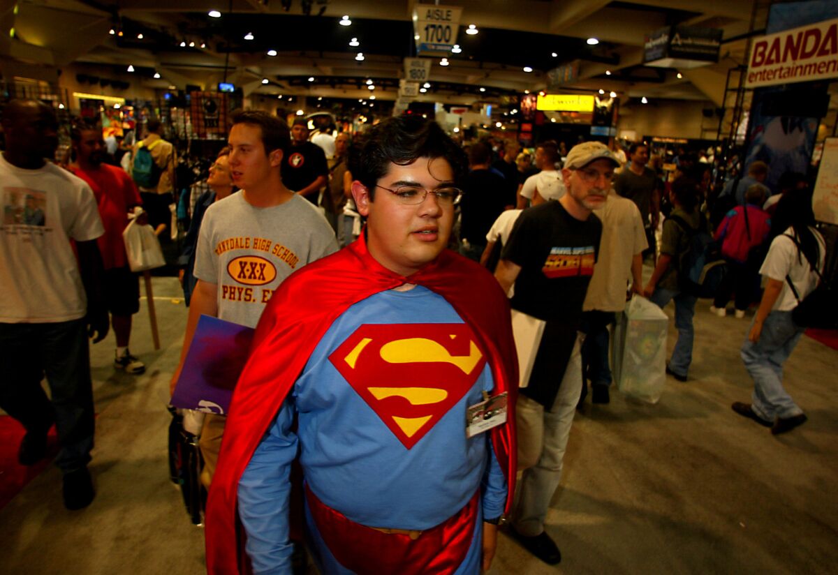 Matthew Rios, 18, of San Diego, walks through a crowded San Diego Convention Center in his homemade Superman costume in 2002.