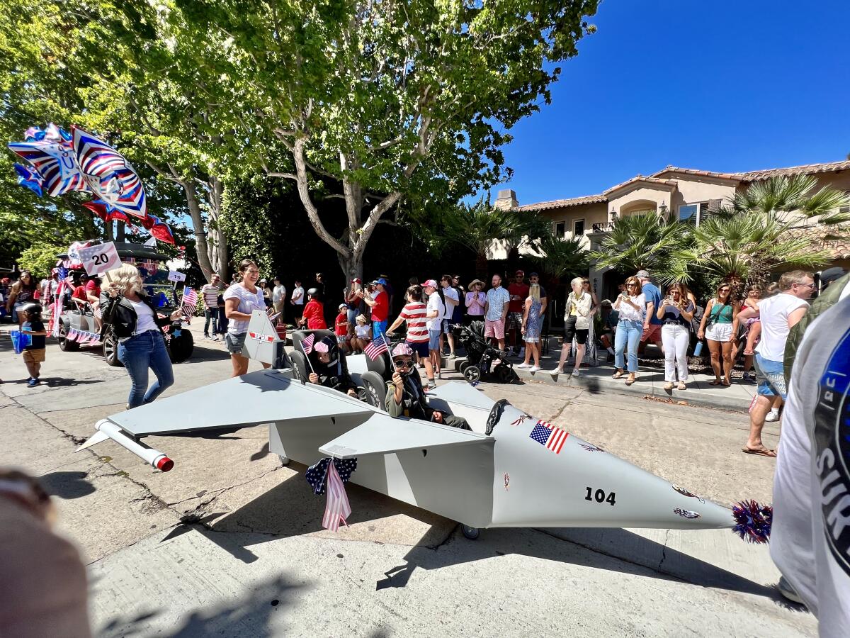 Little pilots "fly" down Beaumont Avenue for Bird Rock's "Top Gun"-themed Fourth of July parade last year.