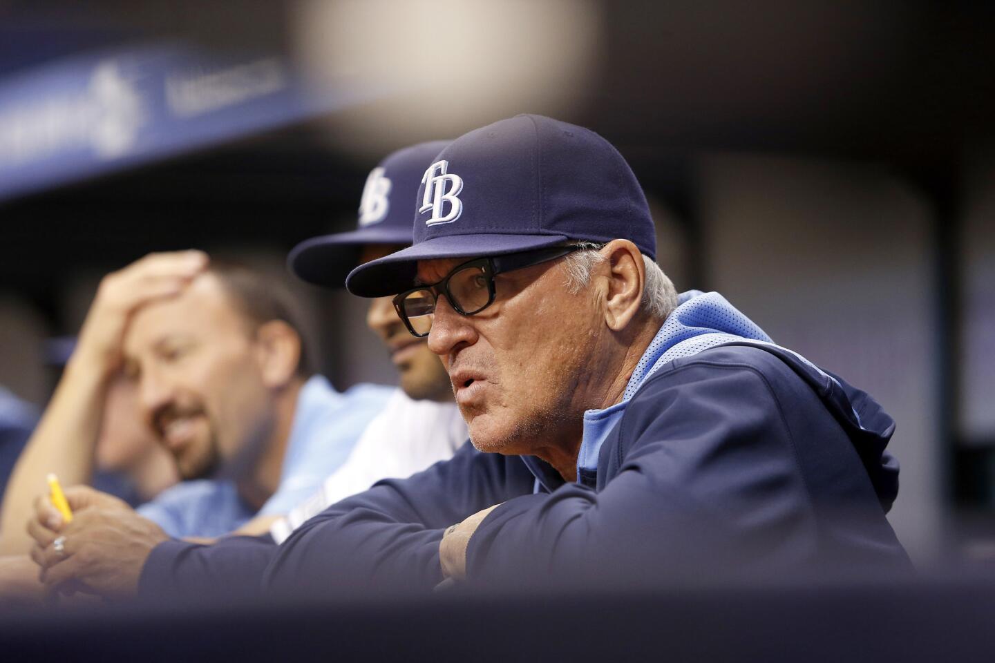 Joe Maddon looks on from the dugout.