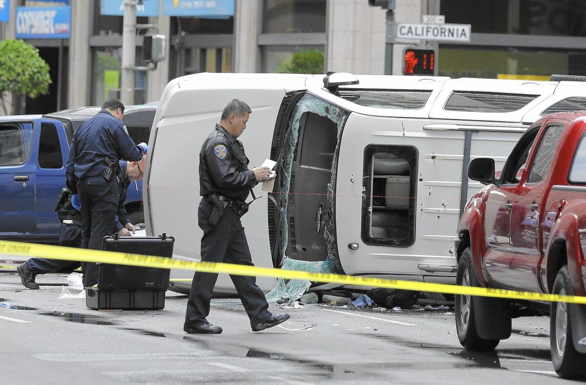 San Francisco police officers investigate the scene where a high-speed car chase ended with a crash and the fatal shooting of a carjacking suspect in September. The city saw an increase in the rates of property and violent crime between 2012 and 2013.