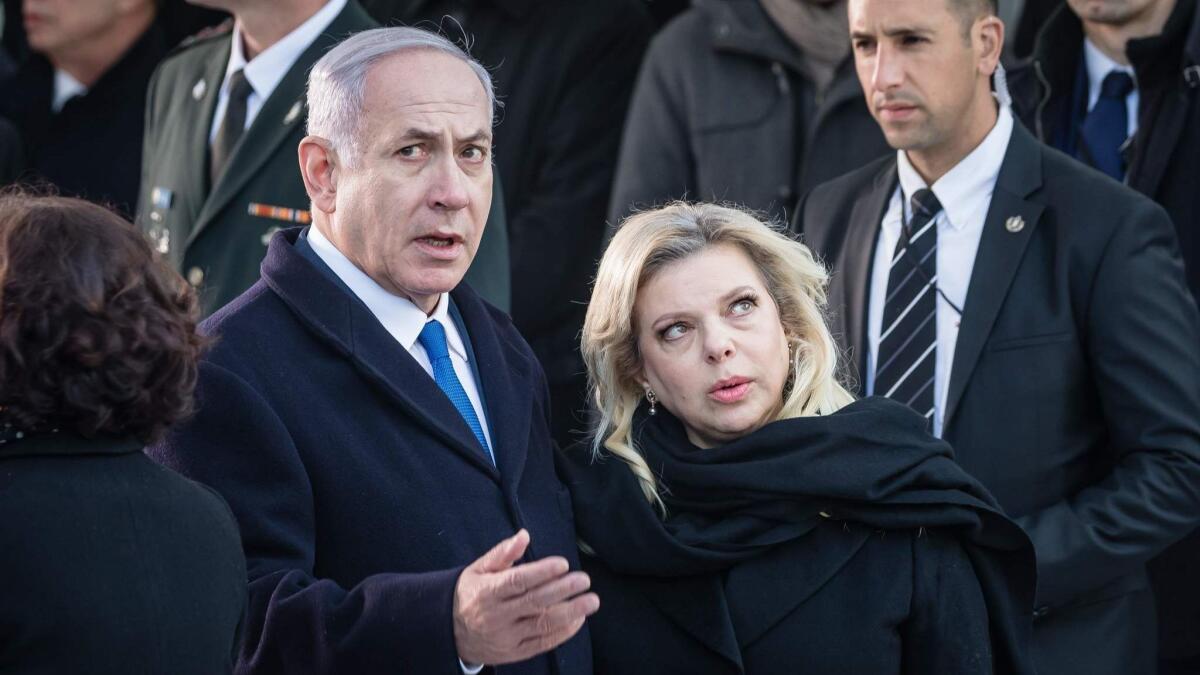 Israeli Prime Minister Benjamin Netanyahu, with wife Sara at a Feb. 14 event in Warsaw, faced censure over statements made during the Mideast conference there.
