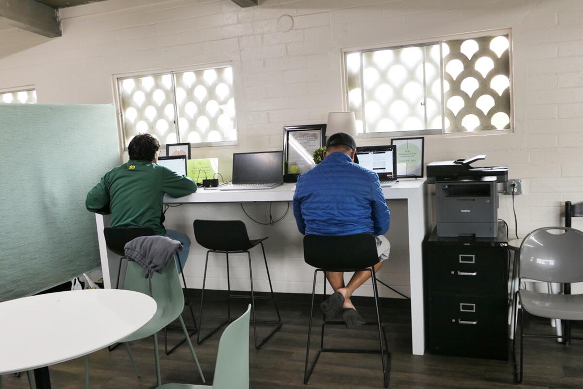 Guests using the computers, one of the many services offered by The Compass Station.
