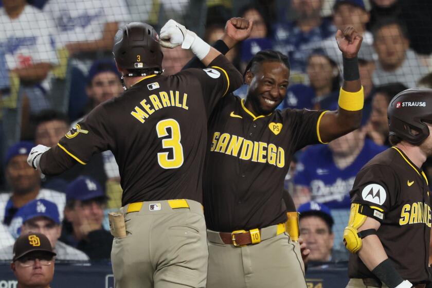 LOS ANGELES, CALIFORNIA - OCTOBER 06: Jackson Merrill #3 of the San Diego Padres celebrates.