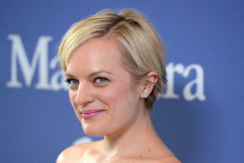 Actress Elisabeth Moss was at home in New York when she got the happy news about her two Emmy nominations.