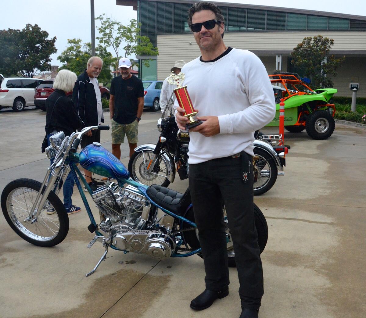 Brian Wilson received Best Motorcycle award for his 1965 Harley Davidson chopper during the OASIS Car Show Saturday.