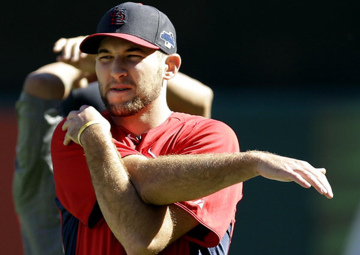 Cardinals pitcher Michael Wacha stretches during a workout Tuesday in St. Louis.