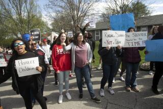 Protestors march Sunday, April 16, 2023, in Kansas City, Mo., to bring attention to the shooting of Ralph Yarl, 16, who was shot when he went to the wrong Kansas City house to pick up his brothers. (Susan Pfannmuller/The Kansas City Star via AP)