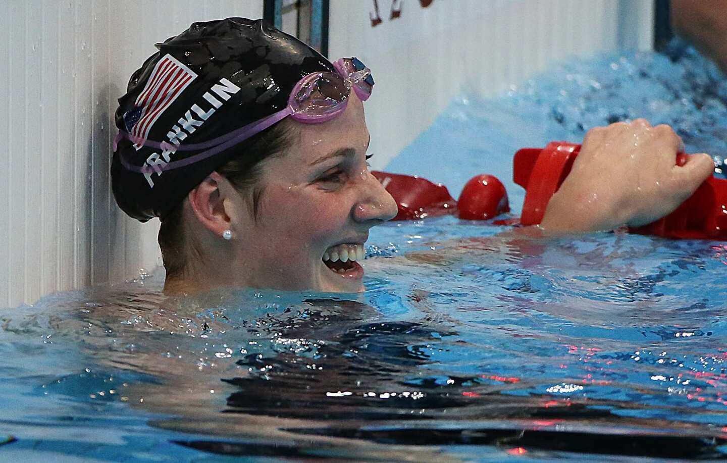 American Missy Franklin is all smiles after her semifinal heat in the 200-meter freestyle on Monday night. Less than 20 minutes later, she won gold in the 100-meter backstroke.