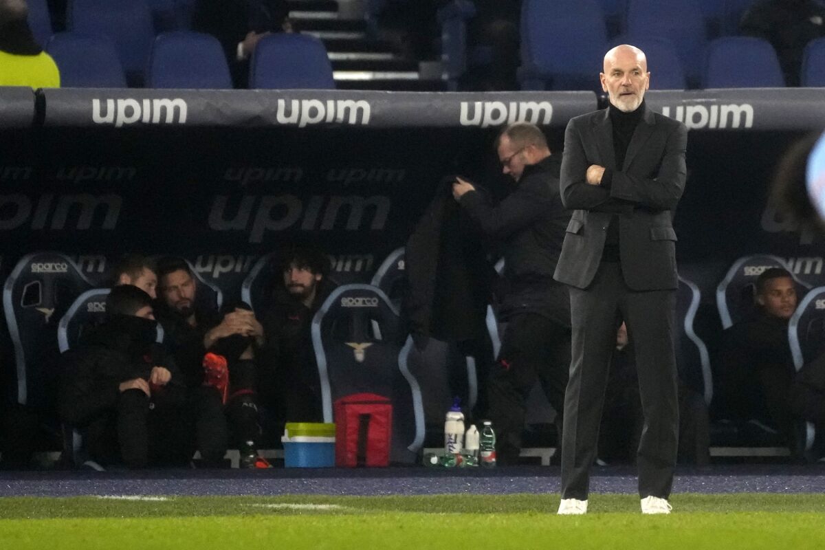 AC Milan's manager Stefano Pioli reacts after the fourth goal against his team during the Italian Serie A soccer match between Lazio and AC Milan at the Olympic Stadium in Rome, Tuesday, Jan. 24, 2023. (AP Photo/Gregorio Borgia)