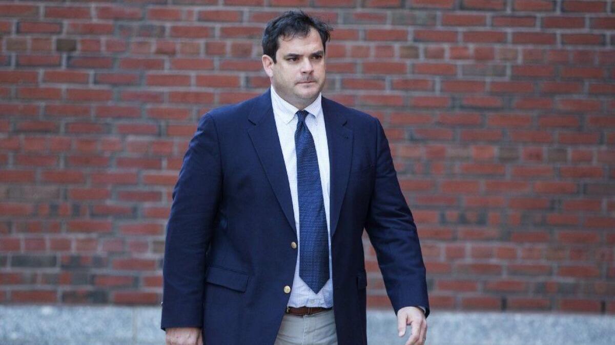 Former Stanford sailing coach John Vandemoer arrives at federal court in Boston for an arraignment on March 12.