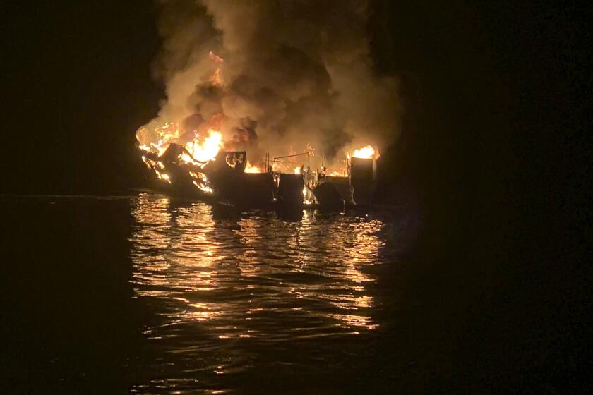 FILE - In this Sept. 2, 2019, file photo, provided by the Santa Barbara County Fire Department, a dive boat is engulfed in flames after a deadly fire broke out aboard the commercial scuba diving vessel off the Southern California Coast. The owners of the dive boat where 34 people perished in a fire off the coast of Southern California filed a legal action in federal court Thursday, Sept. 5, 2019, to head off potentially costly lawsuits. Truth Aquatics Inc., which owned the Conception, filed the action in Los Angeles under a pre-Civil War provision of maritime law that allows it to limit its liability. (Santa Barbara County Fire Department via AP, File)