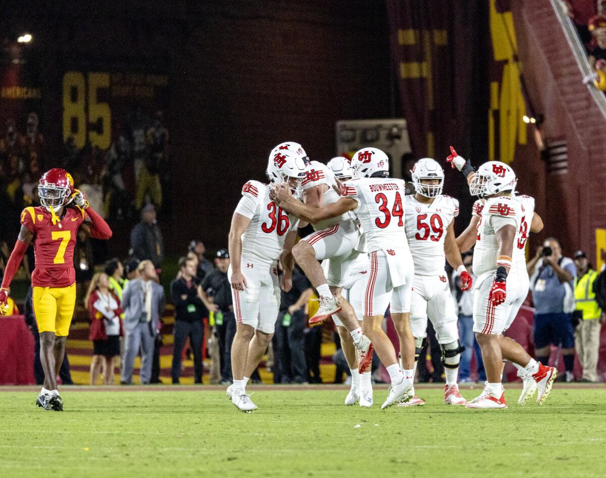 Utah kicker Cole Becker celebrates with teammates after kicking a 38-yard field goal.