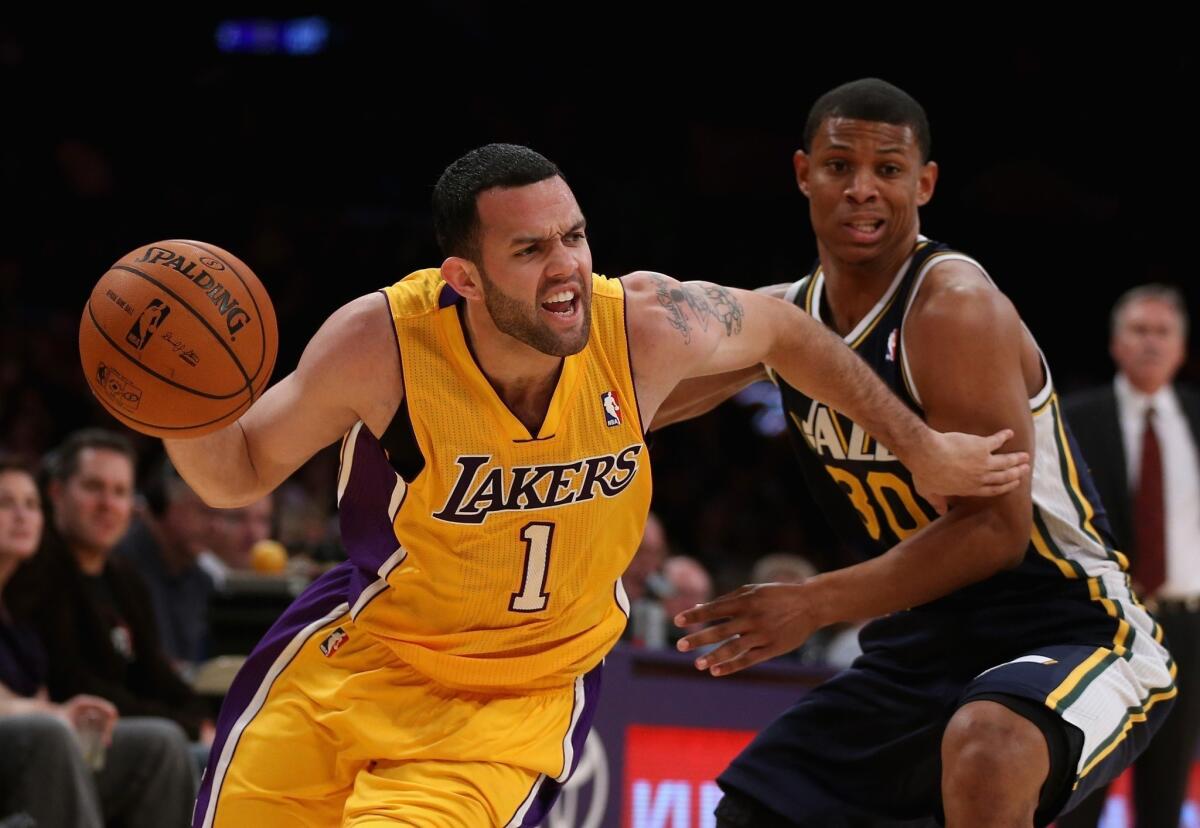 Jordan Farmar, shown dribbling past Utah's Scott Machado on Tuesday night, is leading the Lakers with 13.7 points and 4.7 assists a game during the preseason.