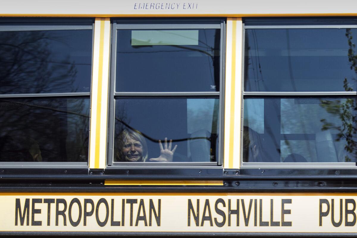 Child crying on bus after mass shooting at Nashville school