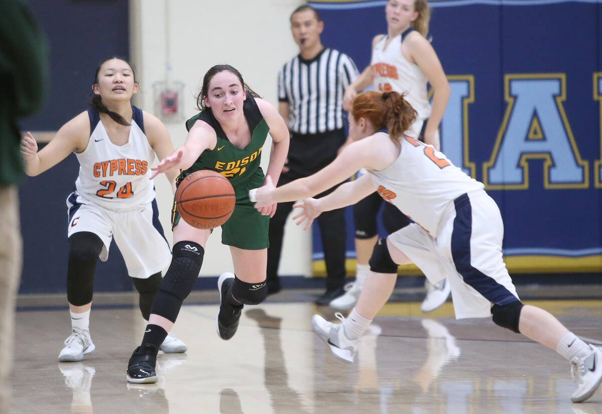 Edison's Taylor Fullbright, center, tries to gather a turnover from Alyssa Allarey (24) before Natasha Ellison, right, gets to the ball in the Larry Doyle and Dan Wiley Tournament of Champions at Marina High on Thursday.
