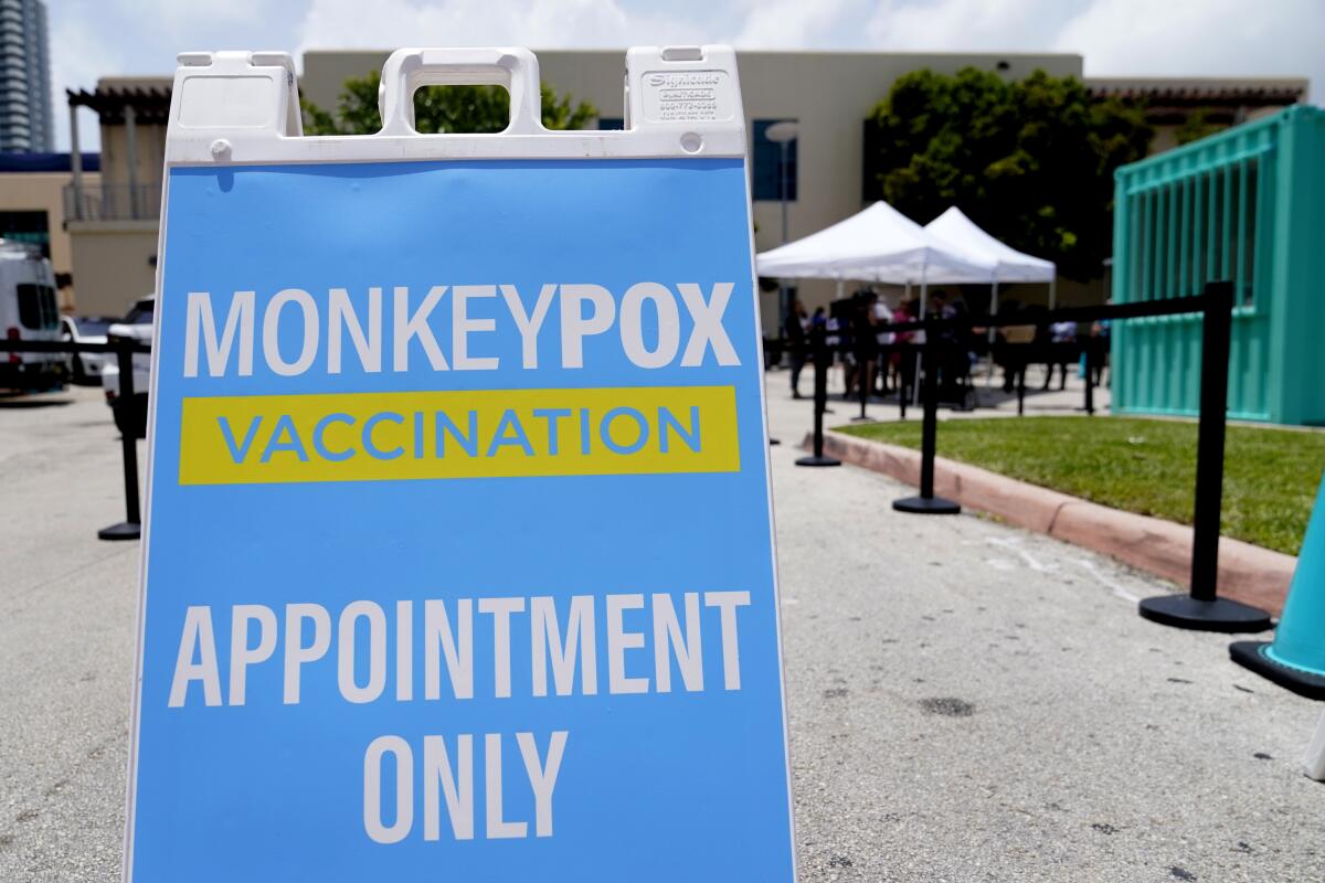 FILE - A sign for monkeypox vaccinations is shown at a vaccination site, Wednesday, Aug. 10, 2022, in Miami Beach, Fla. British health officials say the monkeypox outbreak across the country “shows signs of slowing” but that it's still too soon to know if the decline will be maintained. In a statement on Monday, Aug. 15 the Health Security Agency said authorities are reporting about 29 new monkeypox infections every day, compared to about 52 cases a day during the last week in June (AP Photo/Lynne Sladky, file)