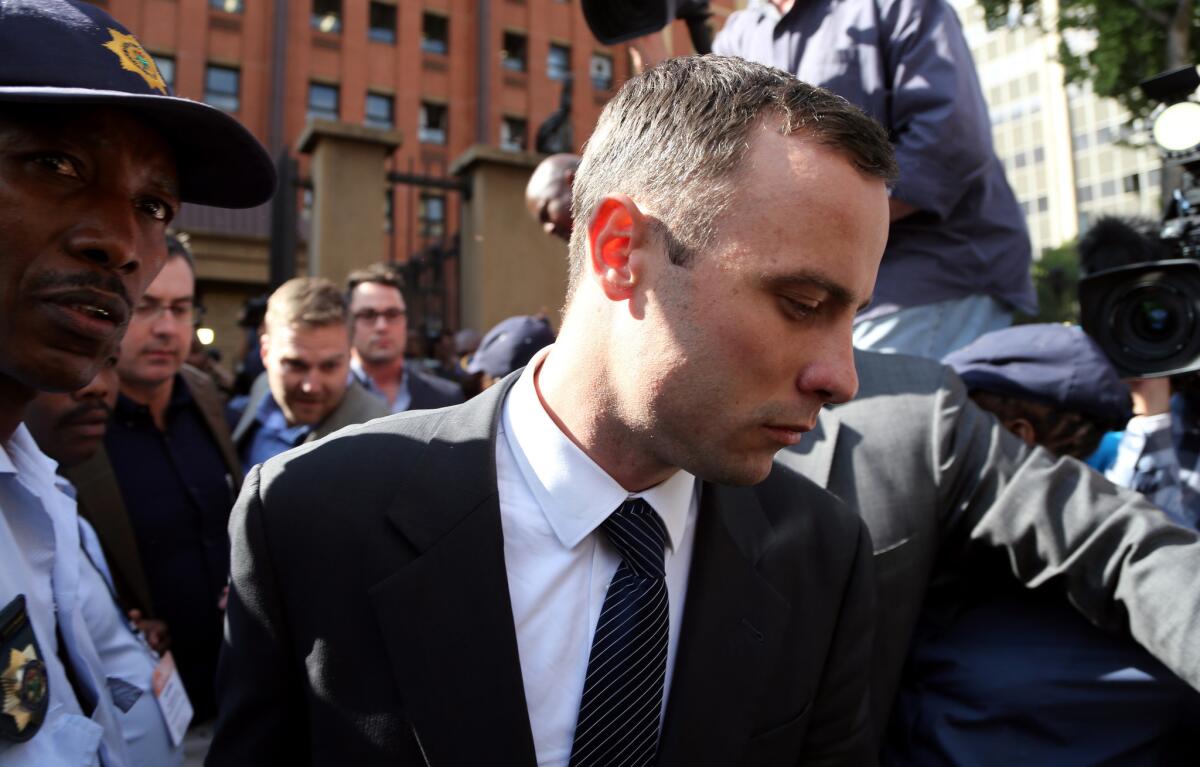 Oscar Pistorius leaves court in Pretoria, South Africa, on Tuesday.