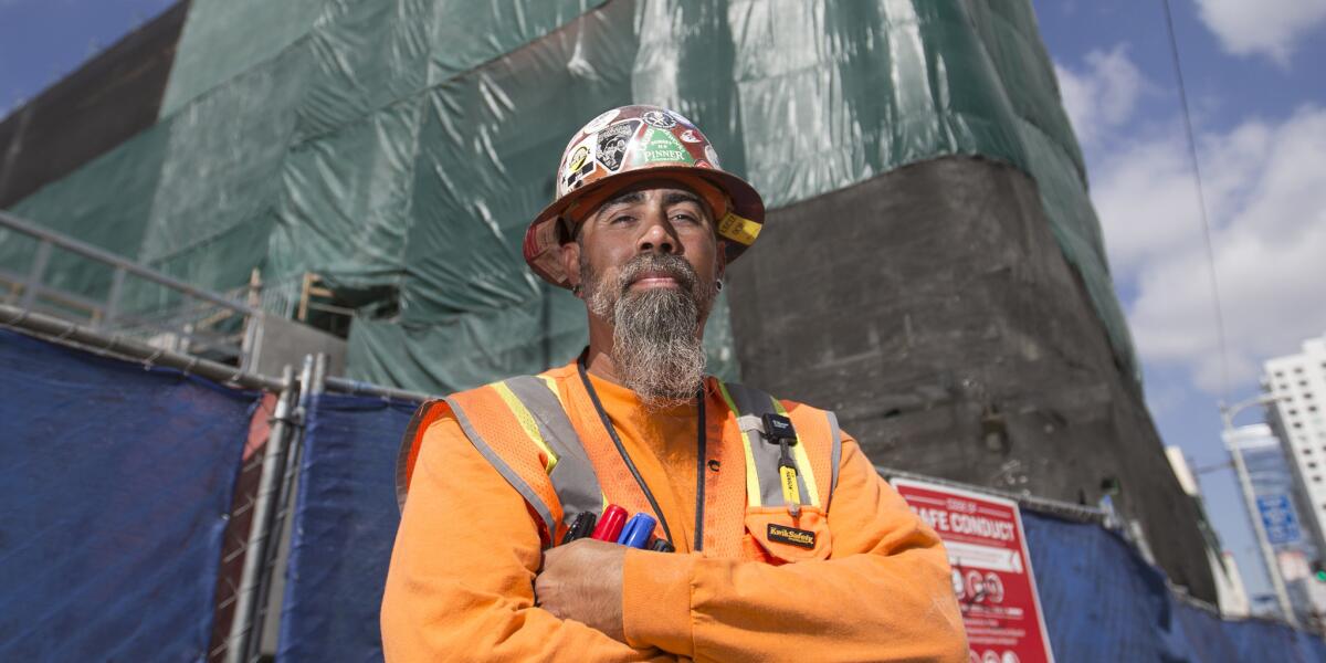 LOS ANGELES, CALIF. -- FRIDAY, APRIL 14, 2017: Friday, April 14, 2017. Eddie Ybarra, a carpenter, shown outside his construction project at 11th and Hill Streets, is a union worker and born in Los Angeles. Ybarra has a solidly middle class life, retirement savings, owns his home. (Allen J. Schaben/Los Angeles Times)