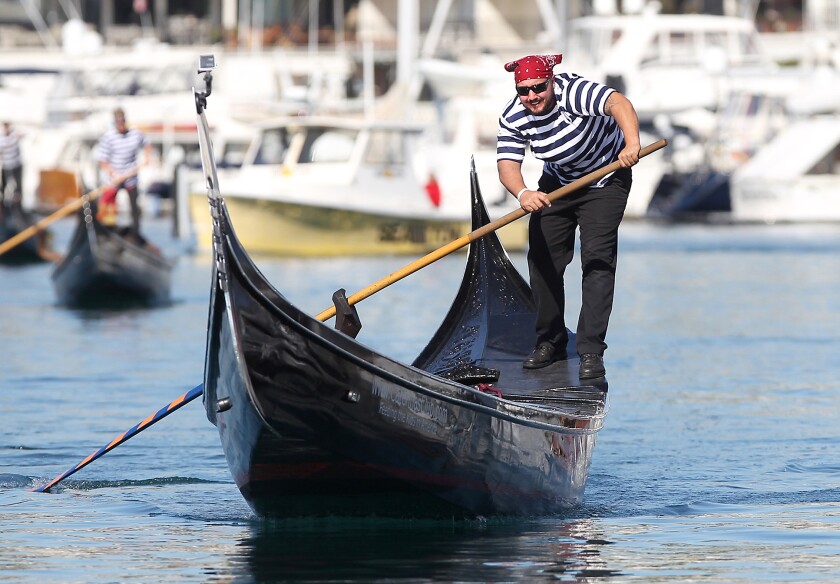 Eric "Enrico" Bender maneuvers his gondola to the finish line during the 2015 U.S. Gondola Nationals at the Bahia Corinthian Yacht Club in Corona del Mar. The competition returns to the club this weekend.
